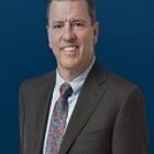 Headshot of James M Crowley