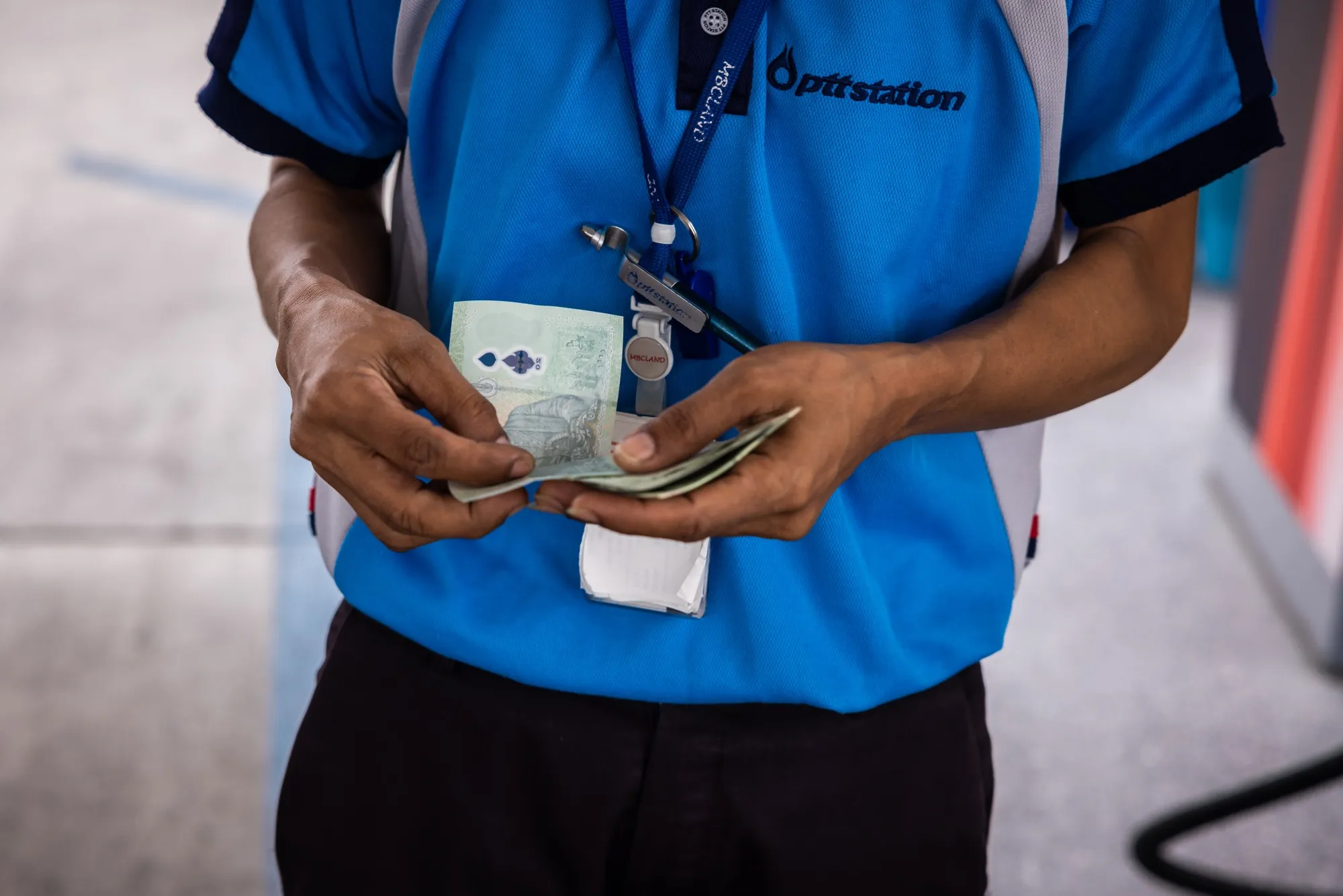 A worker at a gas station in Bangkok.
