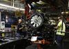 Workers assemble components for a pickup truck at the General Motors Co. (GM) plant in Flint, Michigan, U.S., on Tuesday, Feb. 5, 2019. GM is selling lots of expensive pickup trucks and sport utility vehicles in the U.S., which helped its average vehicle sales price hit a record $36,000. That played a big role in the better-than-expected quarterly earnings.