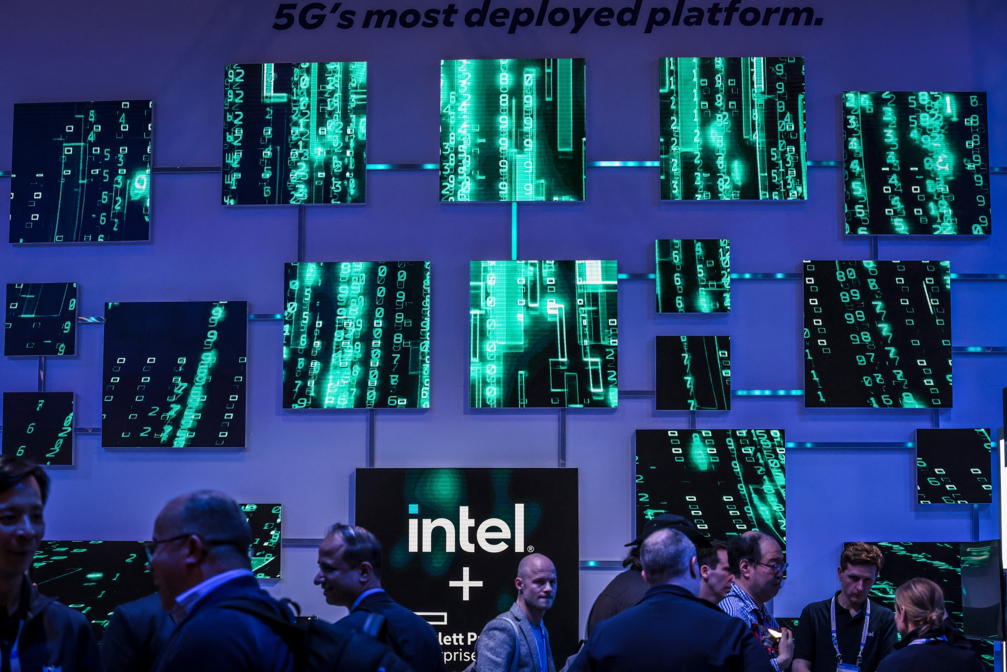Attendees at the Intel Corp. pavilion at MWC Barcelona 2026 in Barcelona, Spain, on Monday, March 2, 2026. This year's edition of MWC is heavily geared toward AI and establishing best practices to leverage it to drive sales and wider adoption.