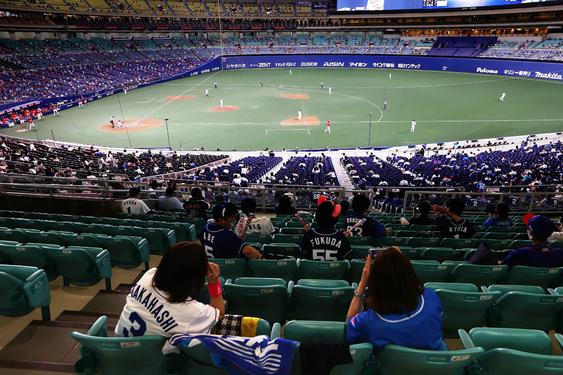 Fans watch a Nippon professional baseball match between Chunichi and Hiroshima in Nagoya on July 10.