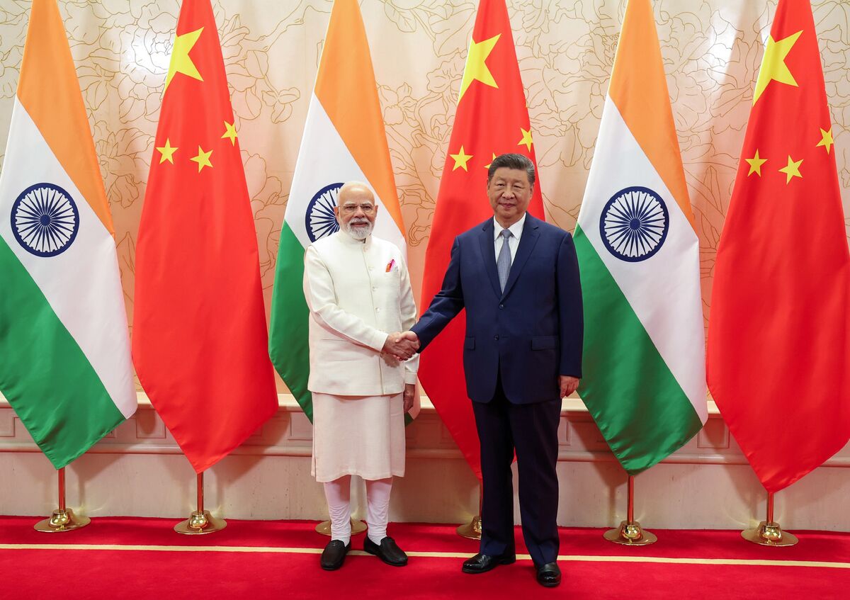 Xi, Modi Vow to Rebuild Ties as US Trade War Adds Pressure