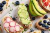 Homemade summer toast with cream cheese Smoked Salmon, Blueberries, Radish, Cucumber, Avocado and cress salad. Fresh healthy concept food