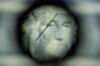 The face of President George Washington is seen through a loupe on a 50 subject one dollar note sheet after being printed by an intaglio printing press in this arranged photograph at the U.S. Bureau of Engraving and Printing in Washington, D.C. U.S.