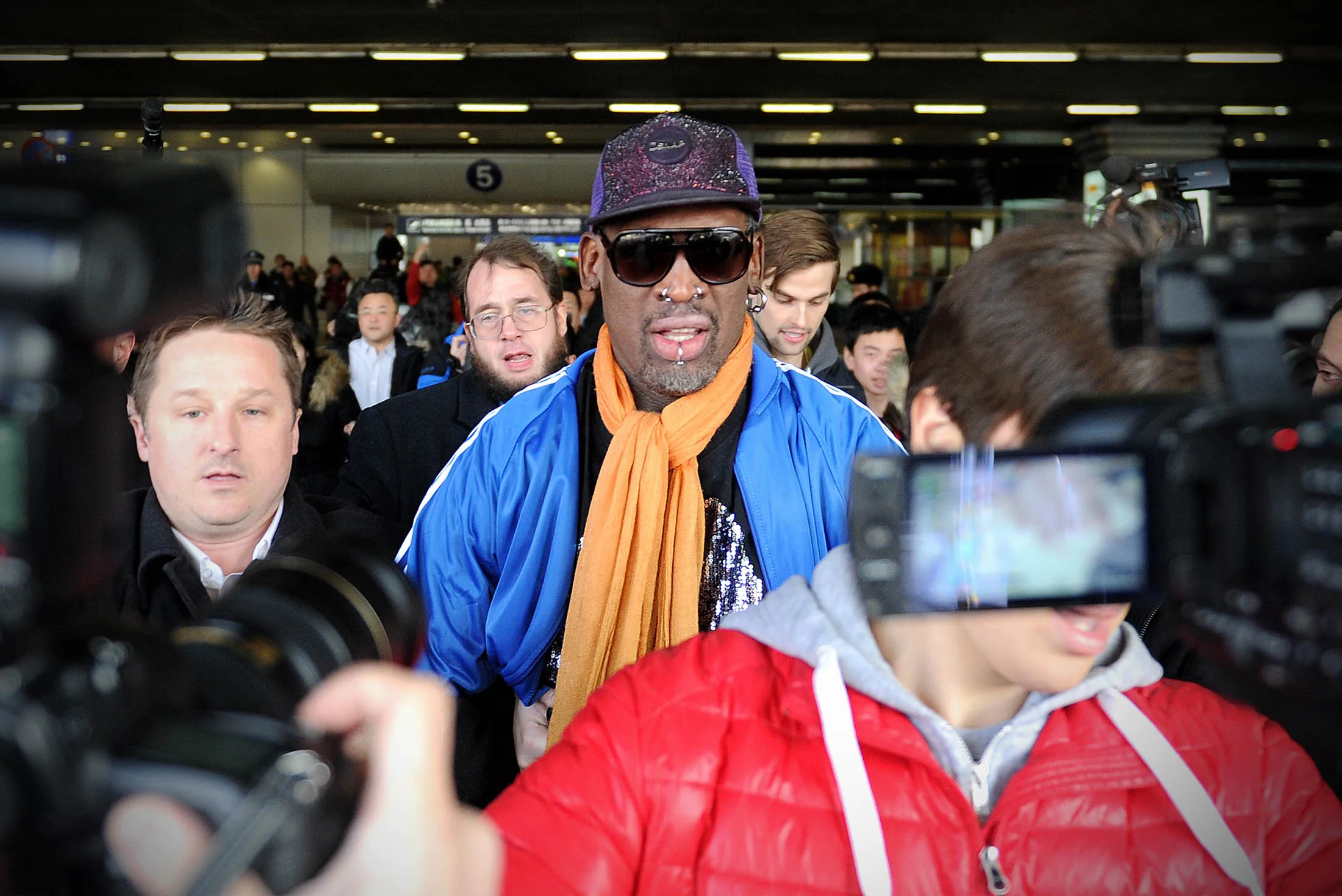 Dennis Rodman arrives at Beijing International Airport from North Korea on January 2014.
