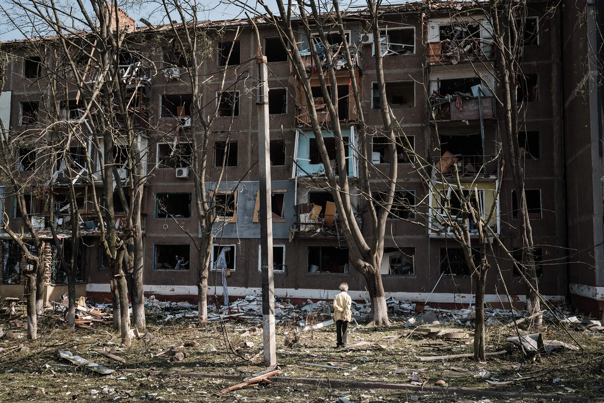 An man stands in front of an apartment damaged by a missiles in Kramatorsk, eastern Ukraine.