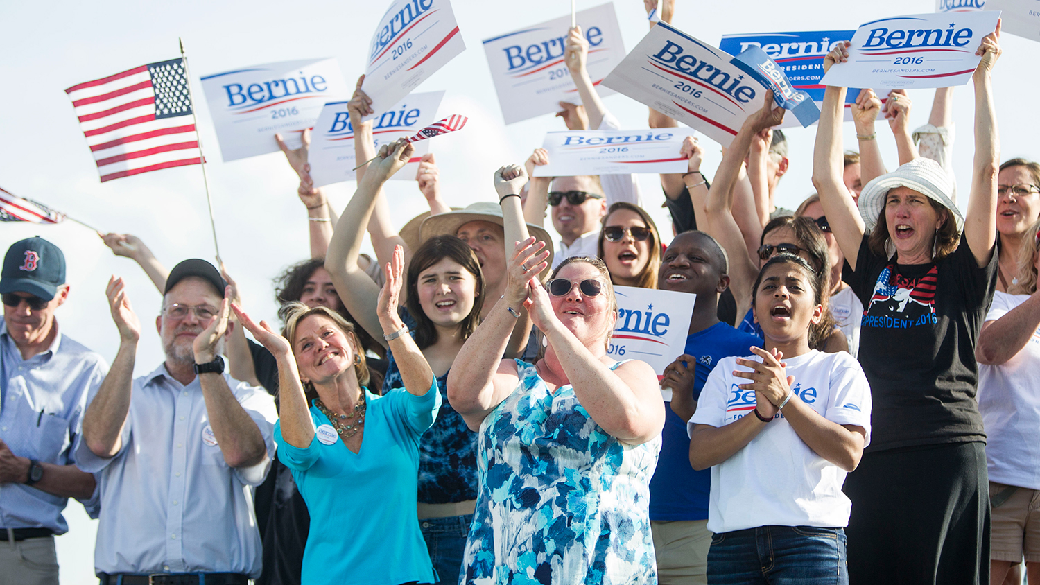 Supporters cheer while holding up signs during the official kickoff to Senator Bernie Sanders' presidential campaign in Burlington, Vermont, U.S., on Tuesday, May 26, 2015.
