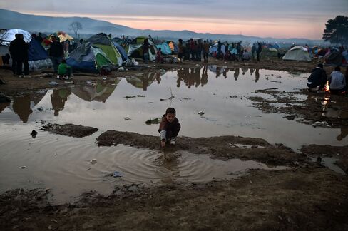 Refugees gather at the makeshift camp near the Idomeni crossing between Greece and the Republic of Macedonia.