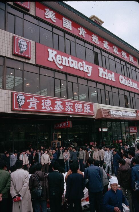 A crowd gathers for the grand opening of China's first Kentucky Fried Chicken restaurant near Tiananmen Square in 1987.