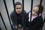 Luis Padilla with his daughter, Isabella, near their home in New York. At 16, Padilla was arrested and sent to Rikers Island.  