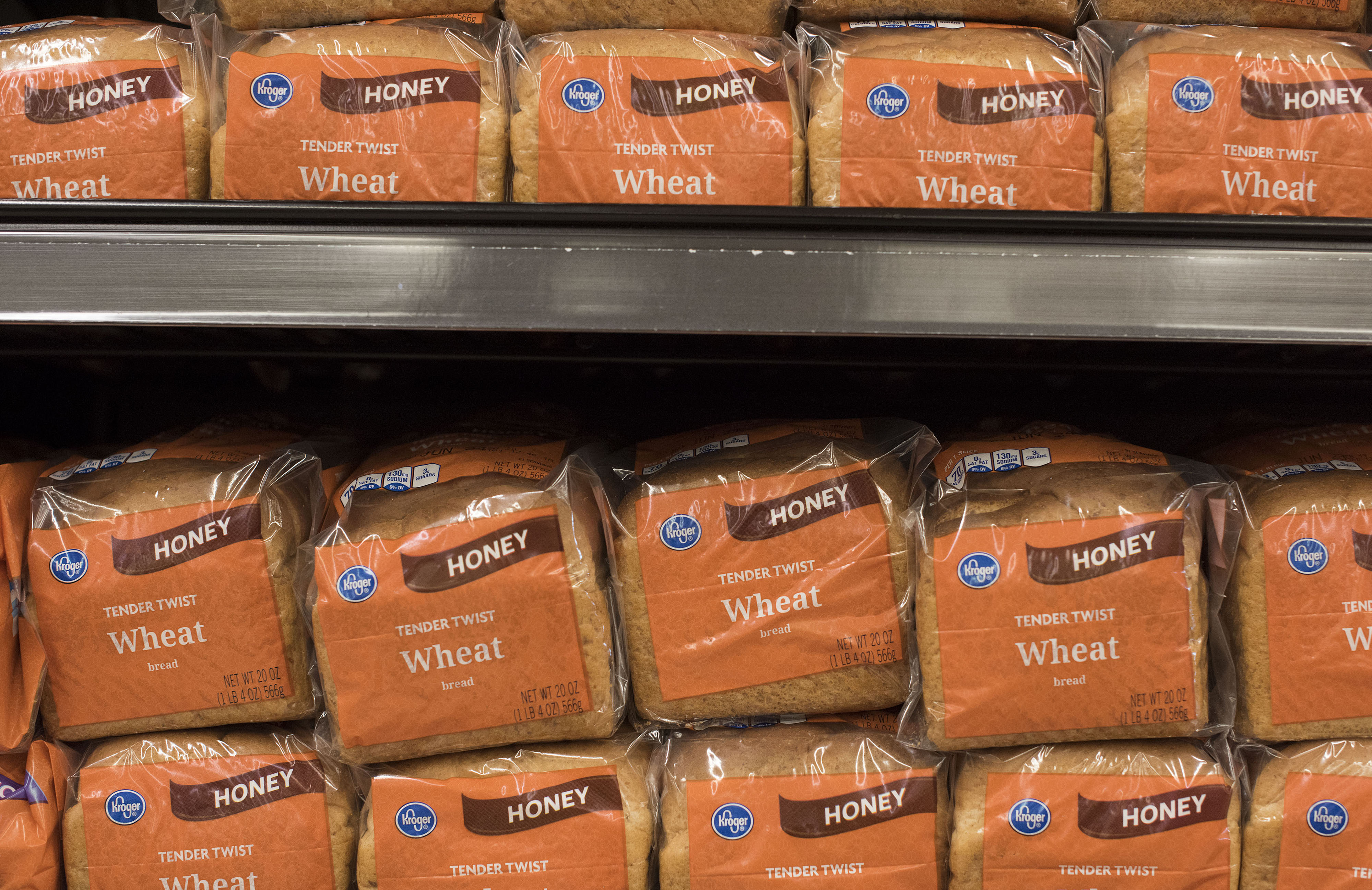 Kroger brand bread sits on a shelf at a Kroger store in Peoria, Illinois, U.S., on Tuesday, June 16, 2015. The Kroger Co. is expected to report quarterly earnings on Thursday, June 18, 2015.

