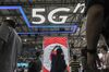 Signage for 5G is displayed at the China Unicom Hong Kong Ltd. booth at the MWC Shanghai exhibition in Shanghai, China, on Thursday, June 27, 2019. The Shanghai event is modeled after a bigger annual industry show in Barcelona.