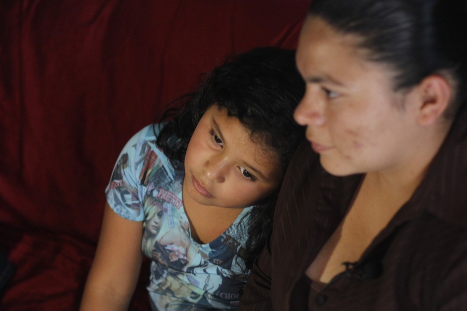 A mother and daughter in their poor, dangerous neighborhood in Honduras after being deported in 2014.