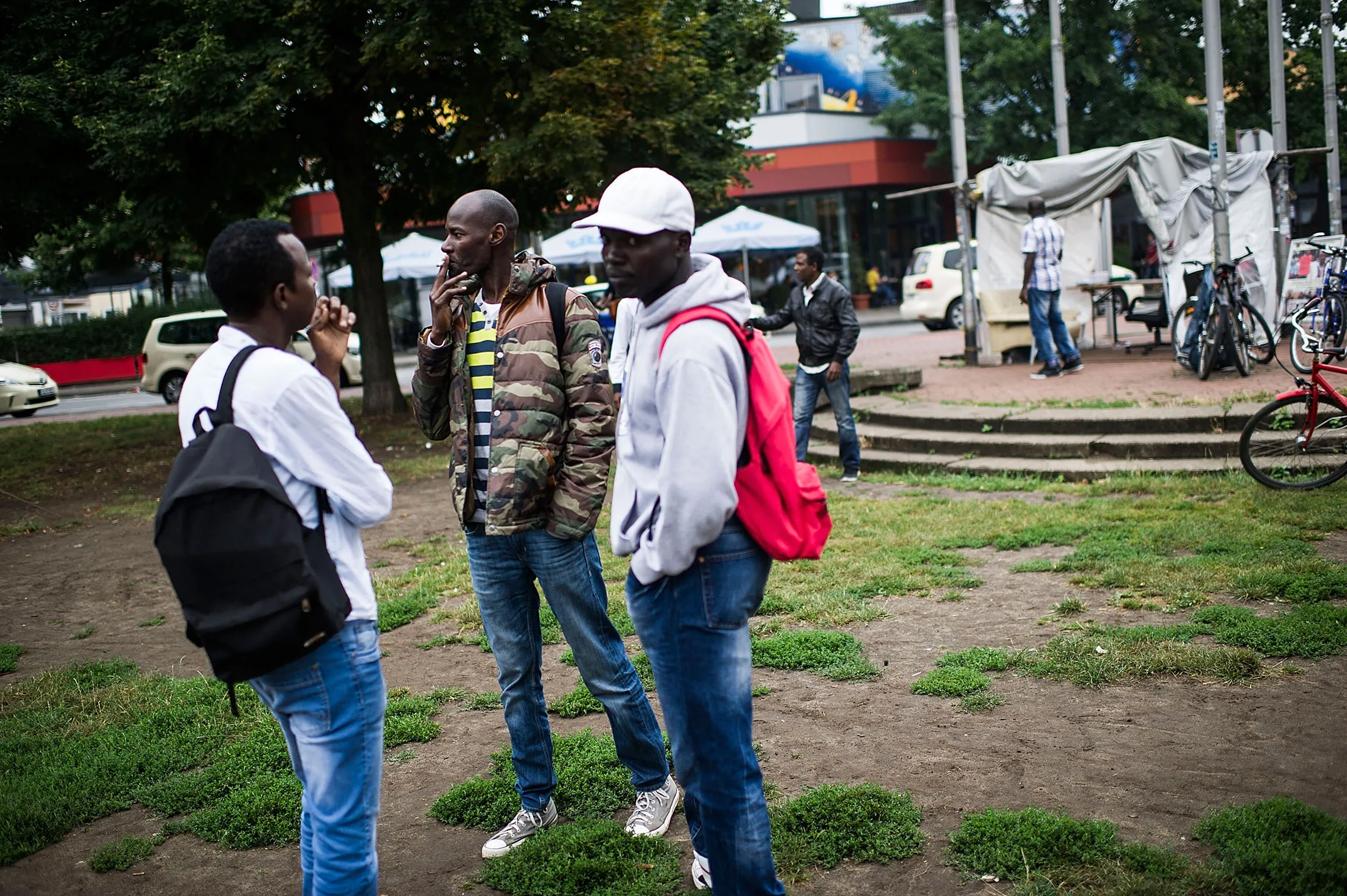 Sudanese refugees gather at a camp at Weissekreuzplatz in Hanover, Germany, on Aug. 17, 2015.
