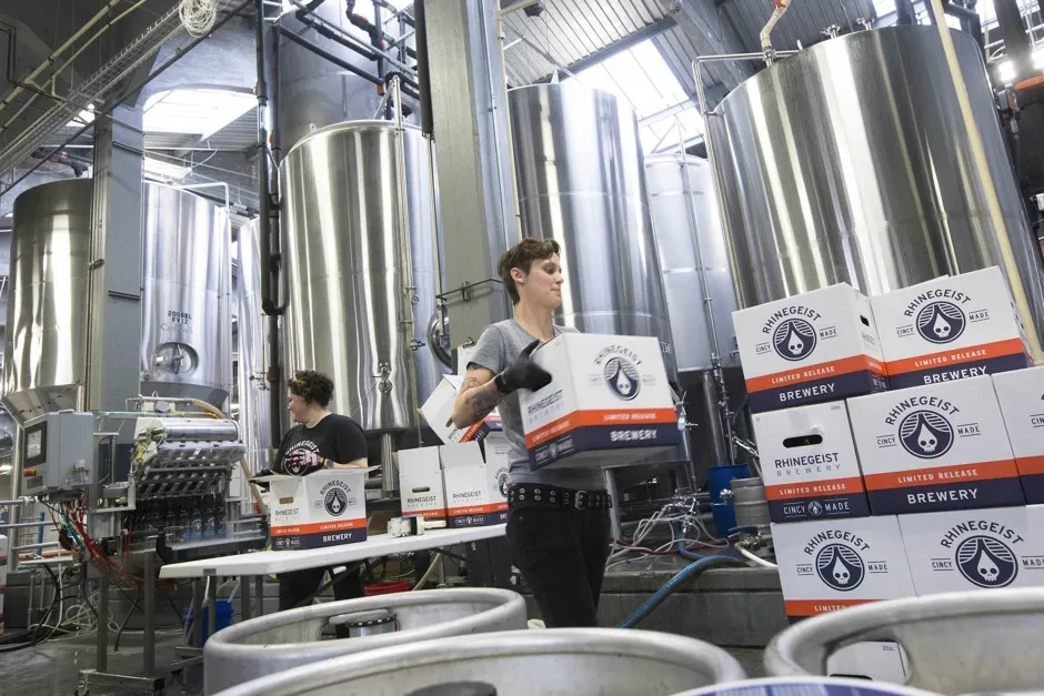 Make beer, not widgets: Sabrina Calhoun loads a pallet with cases of beer at Rhinegeist Brewery in Cincinnati's Brewery District in 2015.