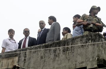 Ajit Doval and other officers during inspection at the site of spot of bomb blast in Burdwan in Oct. 2014. Photographer: Prateek Choudhury/Hindustan Times via Getty Images
