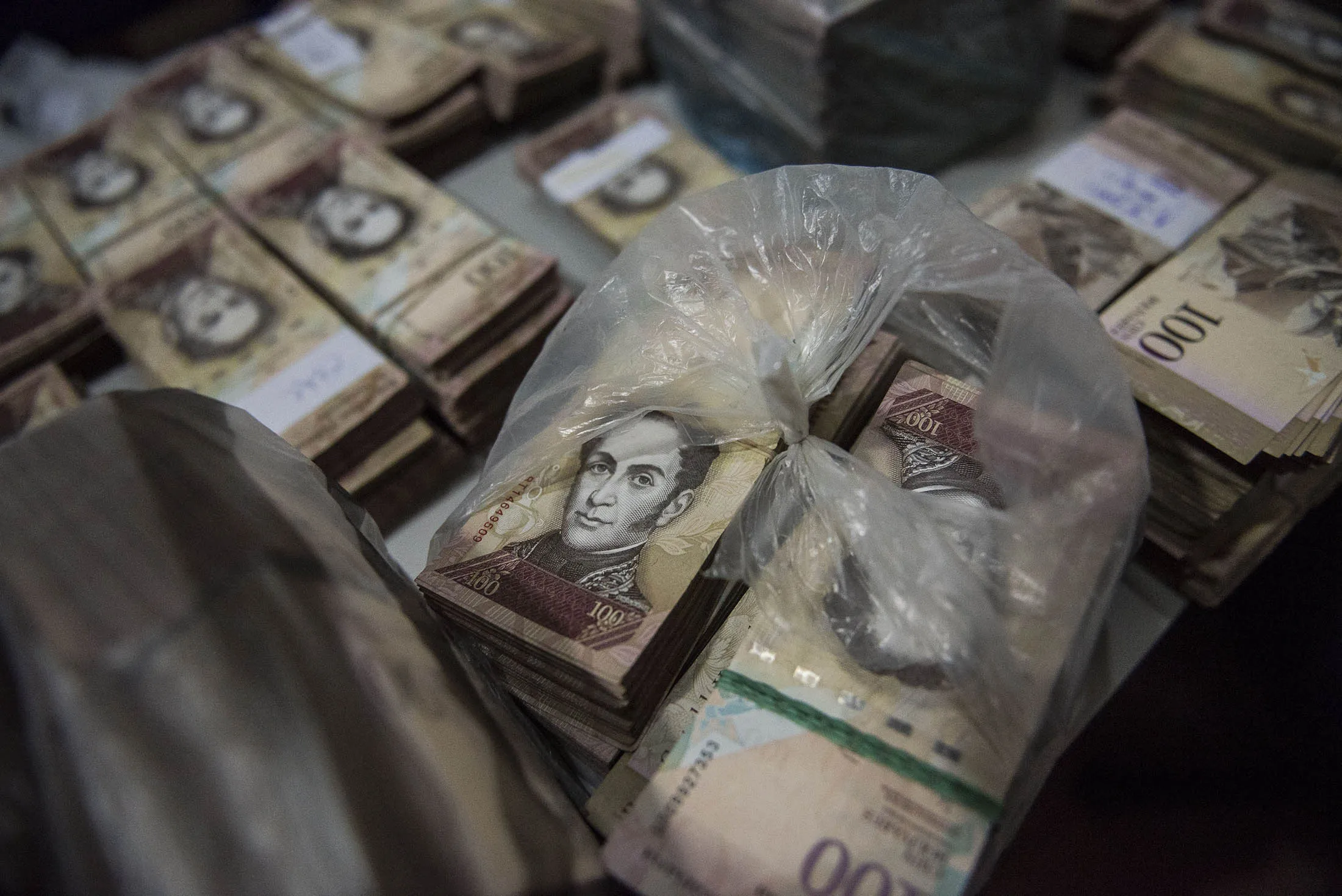 Stacks of 100-bolivar notes.
