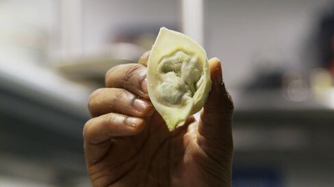 A perfectly wrapped dumpling ready for a boiling water bath.