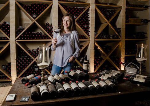 Caroline Frey swirls a glass of her Château La Lagune in the cellar where older vintages are all stored in bins. The 38-year-old once dreamed of a career as an equestrian.