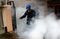 ACEH, INDONESIA - AUGUST 31: Health workers fumigate the area to eradicate mosquitoes that spread diseases such as Aedes aegypti, Zika virus and other dangerous diseases or viruses in Aceh's Banda, Indonesia on August 31, 2016. (Photo by Junaidi Hanafiah/Anadolu Agency/Getty Images)