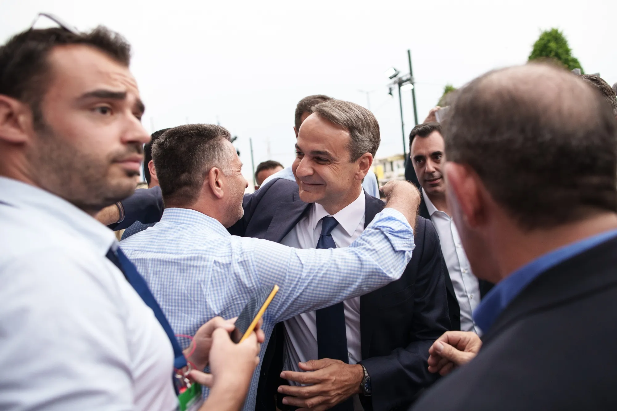 Kyriakos Mitsotakis, center, greets supporters at the party headquarters during elections in Athens, Greece, on June 25.
