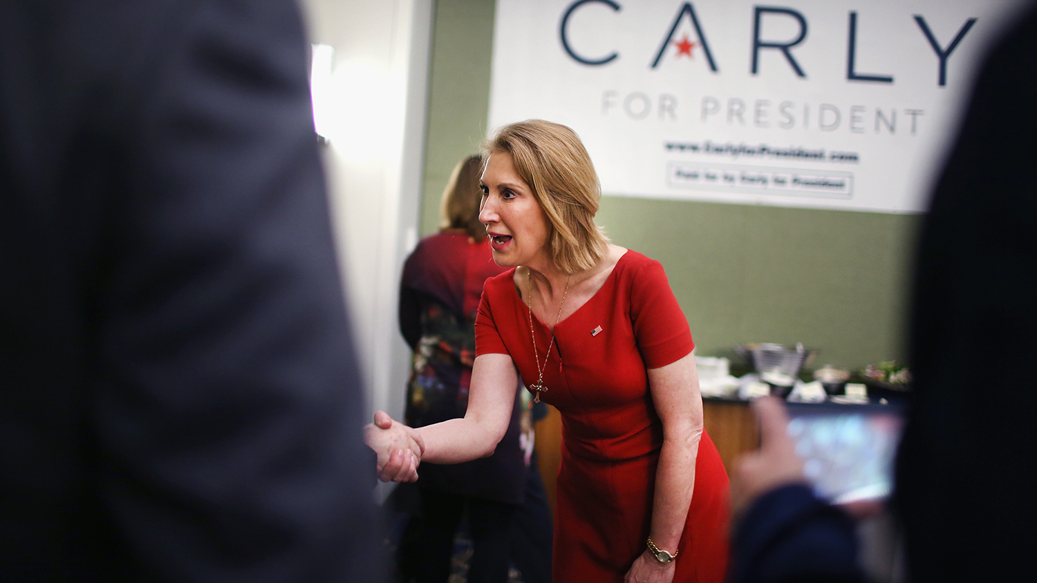 Former business executive Carly Fiorina greets guests at the Republican Party of Iowa's Lincoln Dinner at the Iowa Events Center on May 16, 2015 in Des Moines, Iowa.

