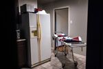 A stretcher waits in a kitchen as a funeral home worker prepares to transport the body of a woman&nbsp;who died of Covid-19 in her bed at home in Houston.&nbsp;