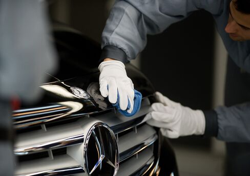 Europe’s Crisis Creeps North as Schneider, Daimler Cut Targets