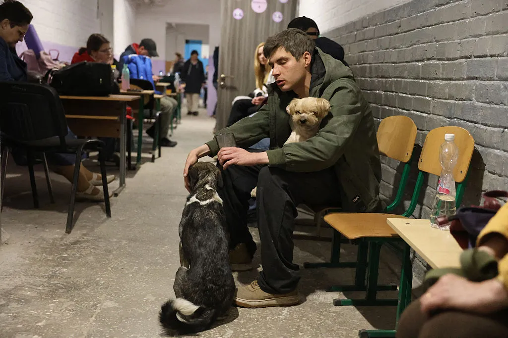 Kiyv residents take cover from Russian missile attacks in an underground shelter in the early morning hours today.