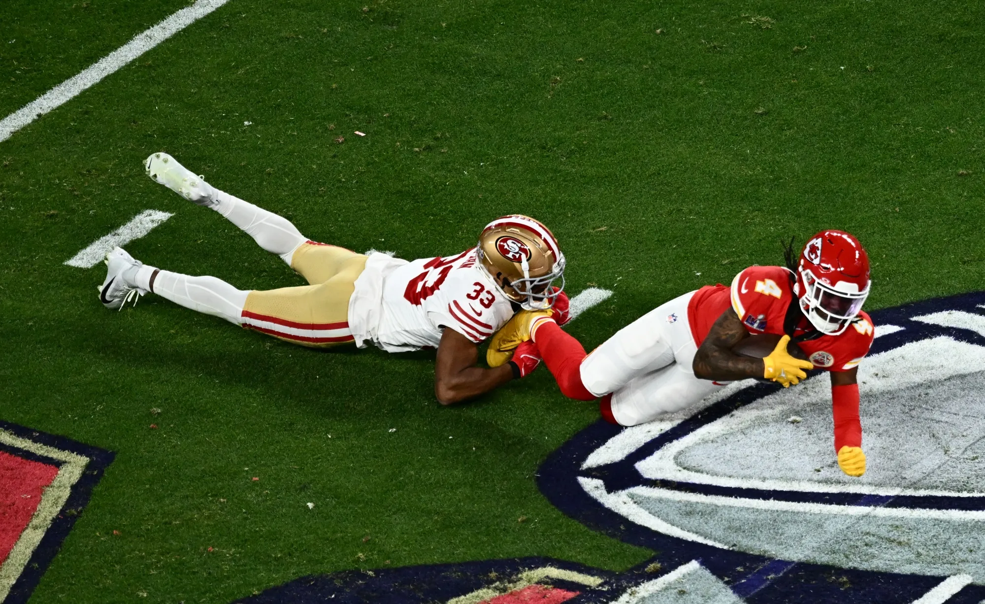 San Francisco 49ers' safety&nbsp;Logan Ryan tackles Kansas City Chiefs' wide reciever&nbsp;Rashee Rice during Super Bowl LVIII on Feb. 11.