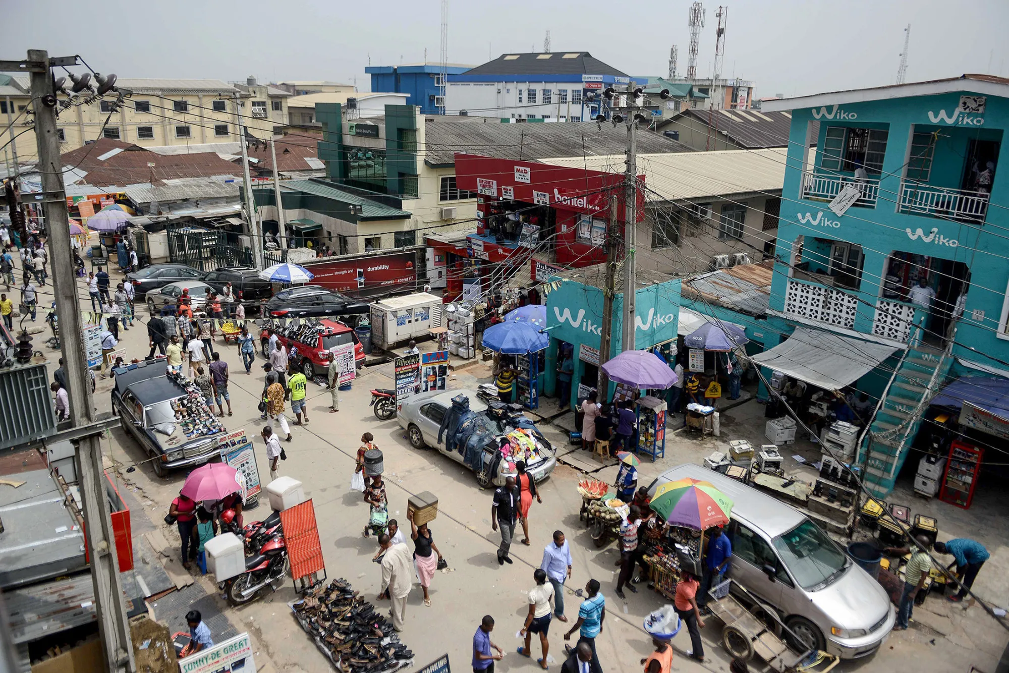 Nigerians at the 'Computer Village', the bazaar where electronic products such as mobile phones, computer hardware and accessories are sold, in the Ikeja suburb of Lagos, on Feb. 24, 2015.

