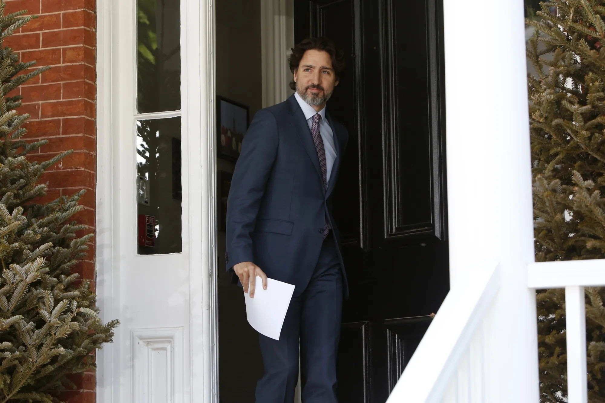 Justin Trudeau arrives at a daily briefing outside his Ottawa residence on May 27, 2020.