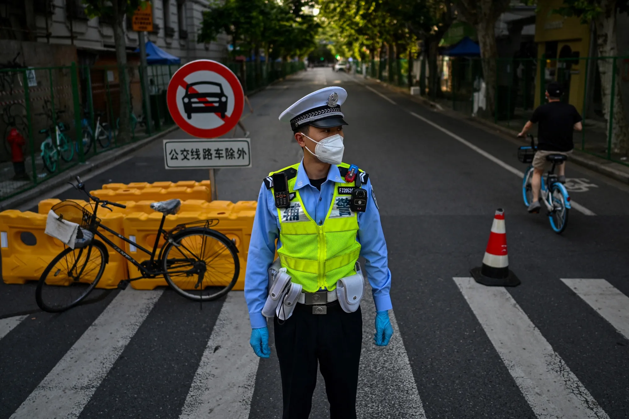 A policeman at a residential area under Covid-19 lockdown in the Xuhui district of Shanghai on June 8.