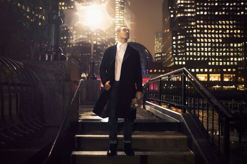 On Kreider: (Here) Formal coat by Paul Smith ($3,800); "Soho" shirt by Paul Smith ($275); jeans by AG Jeans ($245); umbrella by Burberry ($295). (Middle) Double-breasted overcoat by Paul Smith ($1,375); sweater by Paul Smith ($770); jeans by AG Jeans ($245). (Top) Leather jacket by Salvatore Ferragamo ($3,270); sweater by Paul Smith ($525); jeans by AG Jeans ($245).