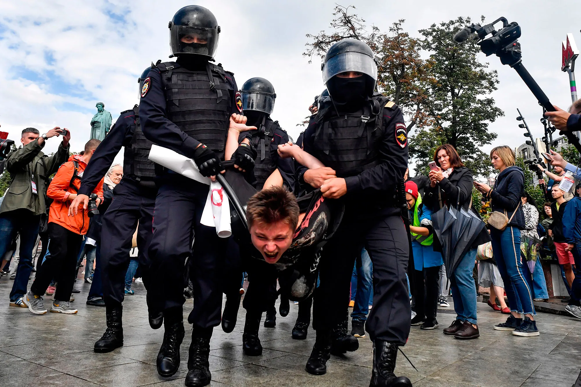 Riot police detain a participant of a rally in Moscow on Aug. 3. 