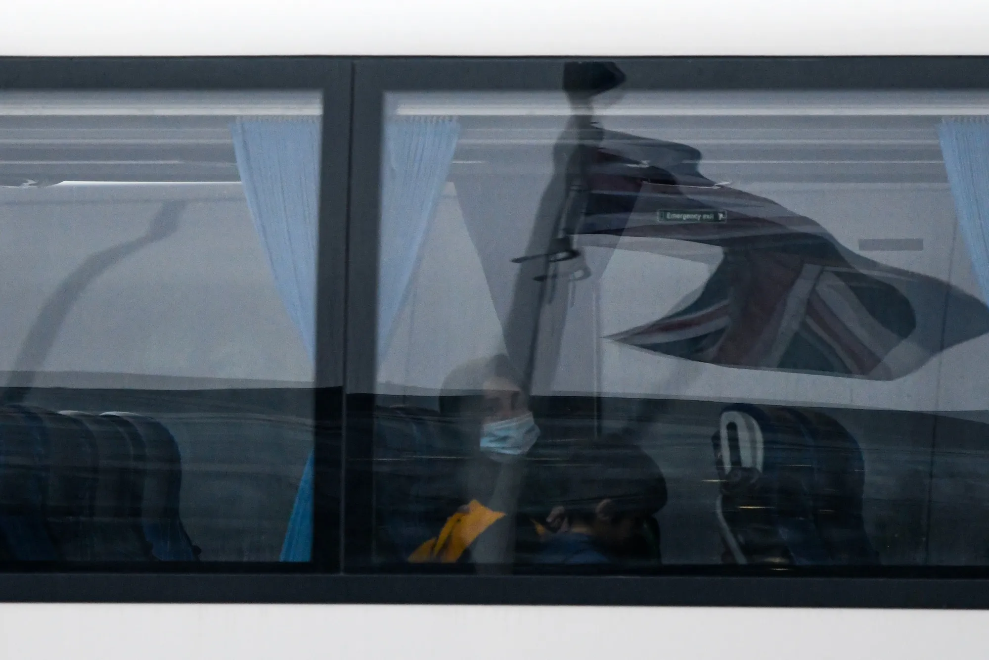 Travelers arrive for quarantine at the Radisson Blu Edwardian hotel at Heathrow Airport in London on Feb. 15.