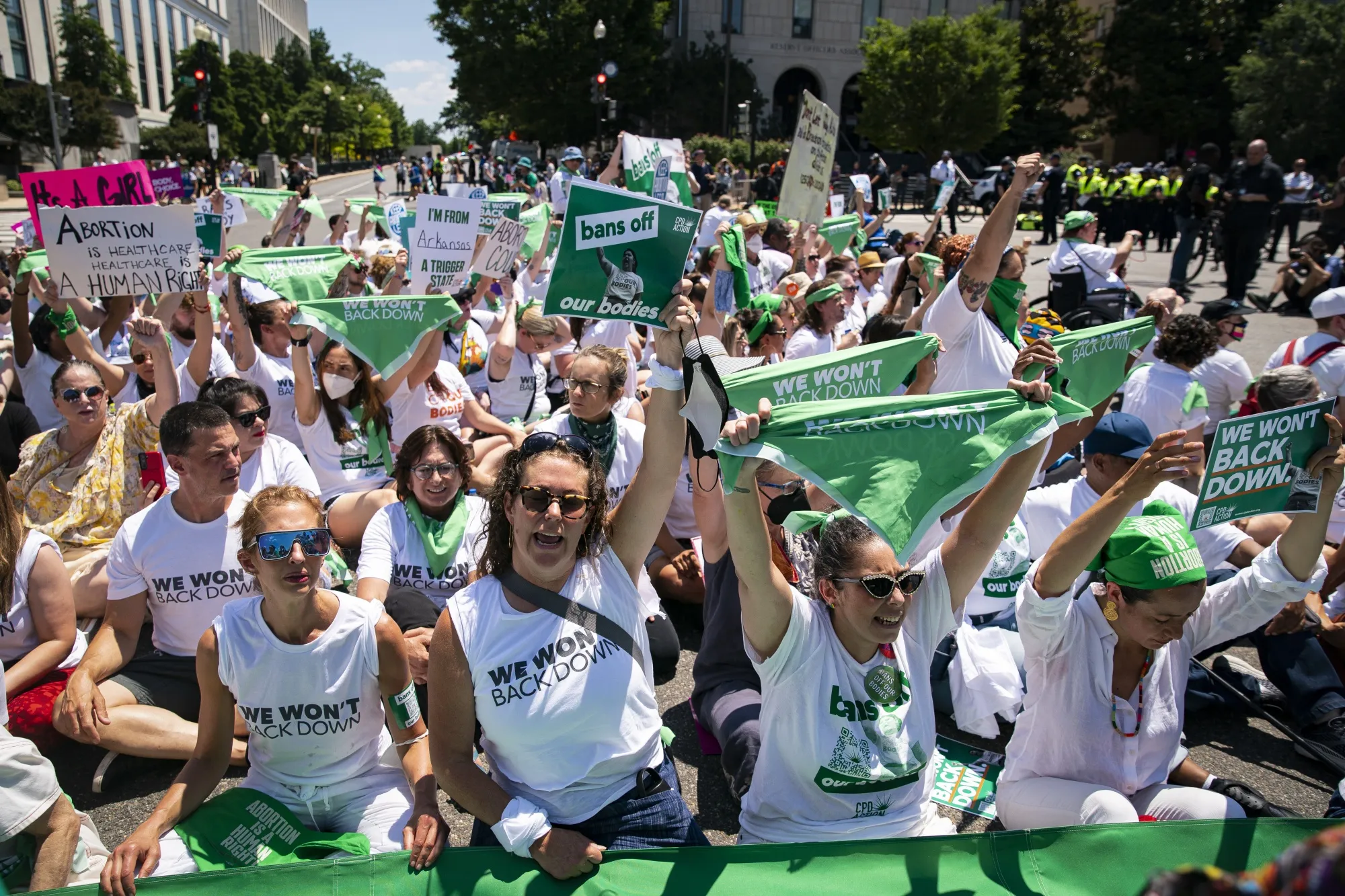 Abortion rights demonstrators block an intersection while sitting in the road during a protest near the US Supreme Court in June.&nbsp;