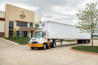 An electric yard truck moving a trailer at Orange EV's factory in Riverside, Missouri.