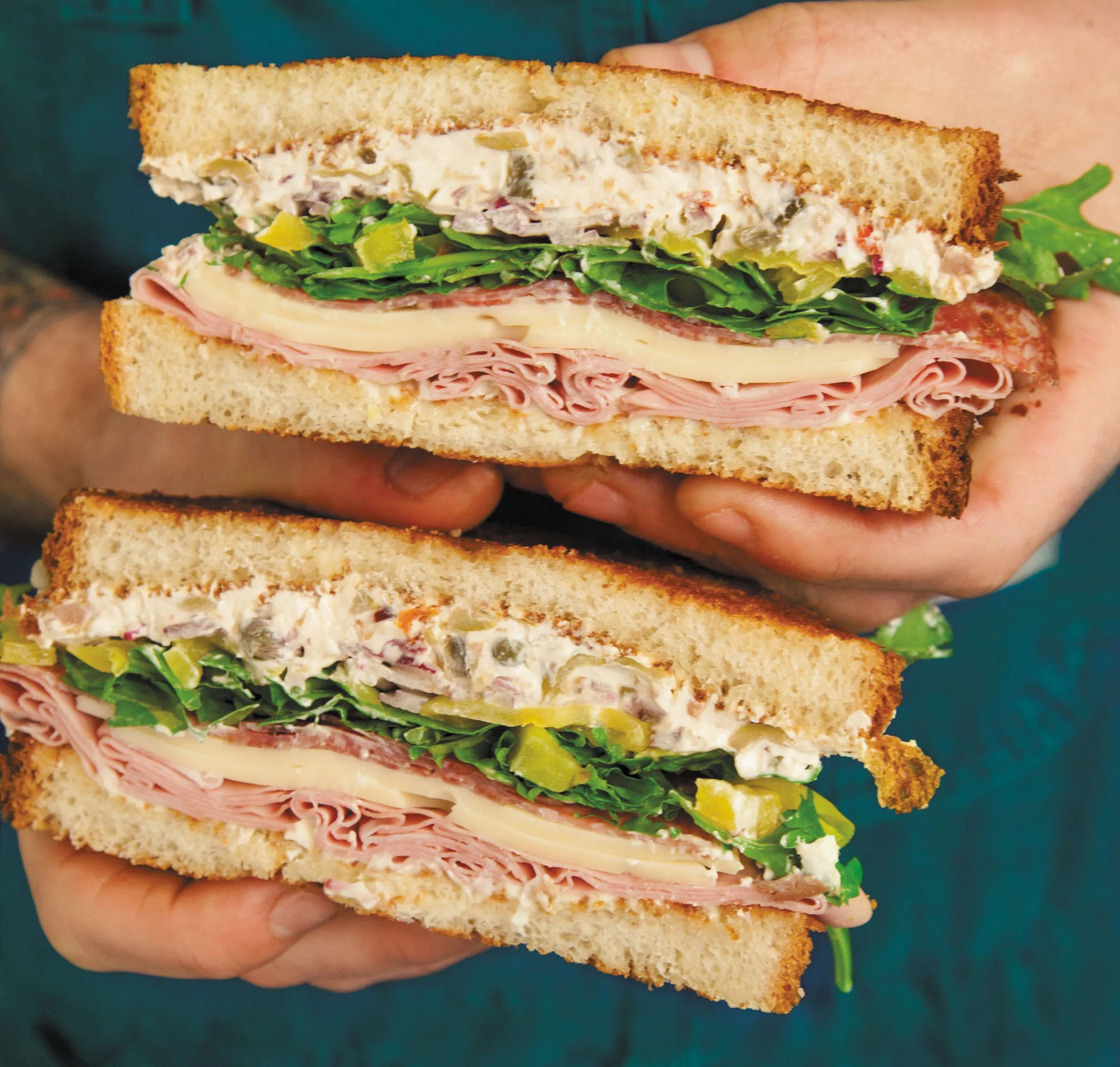 Mason Hereford’s version of the muffuletta includes cream cheese.