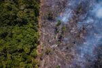 Smoke rises from Brazil's Amazon rainforest outside an indigenous reservation near Jundia in Roraima state.