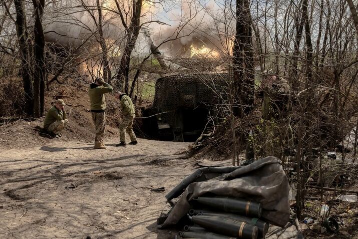 Ukrainian servicemen fire towards Russian positions in an undisclosed area in the Donetsk region.