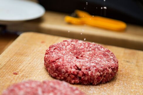 See that divot? Then you haven't seasoned the patty enough. Keep salting till it looks like a light dusting of snow.