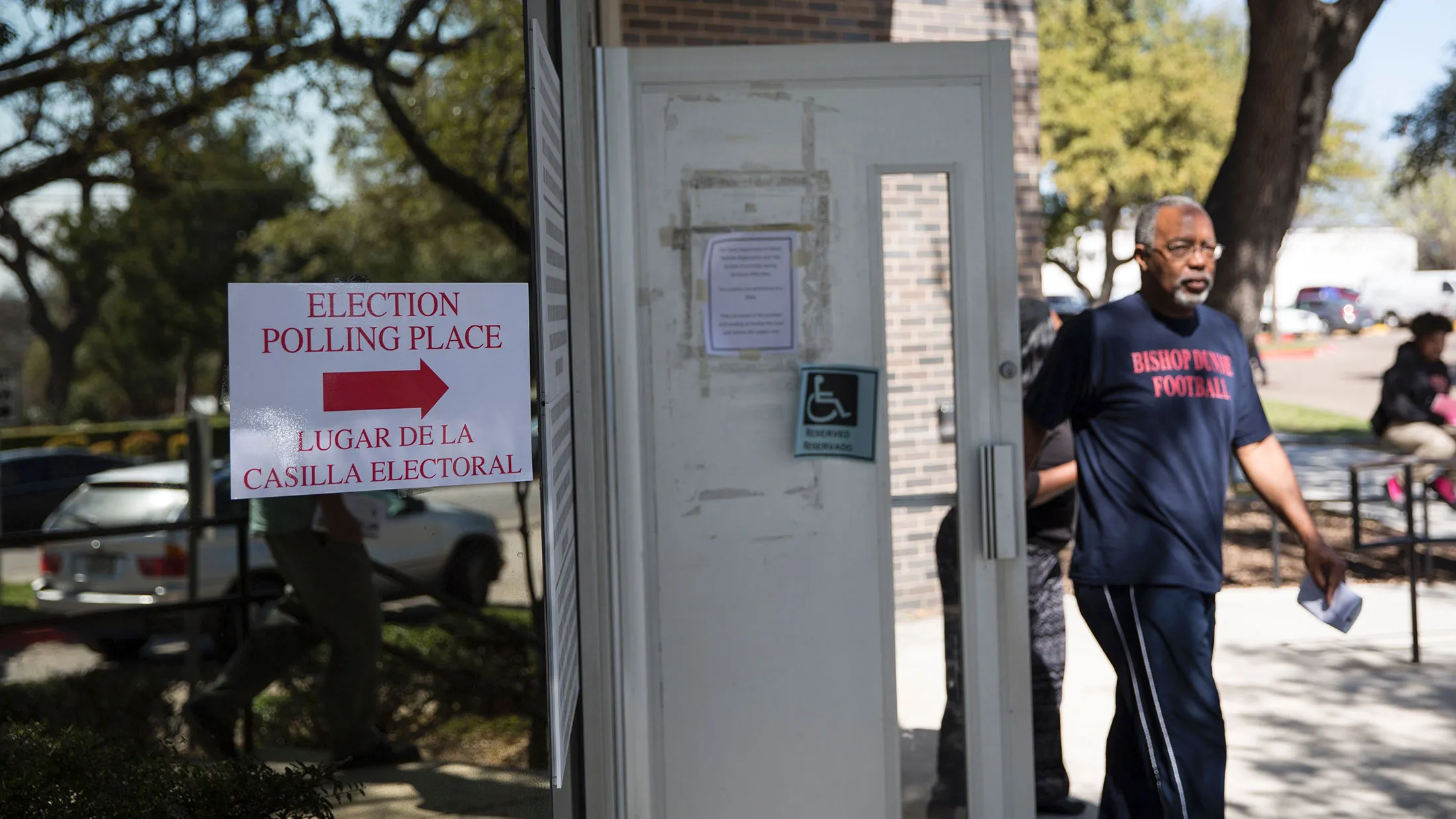 An official polling location sign stands outside a voting center on Super Tuesday, March 1, 2016, in Dallas.
