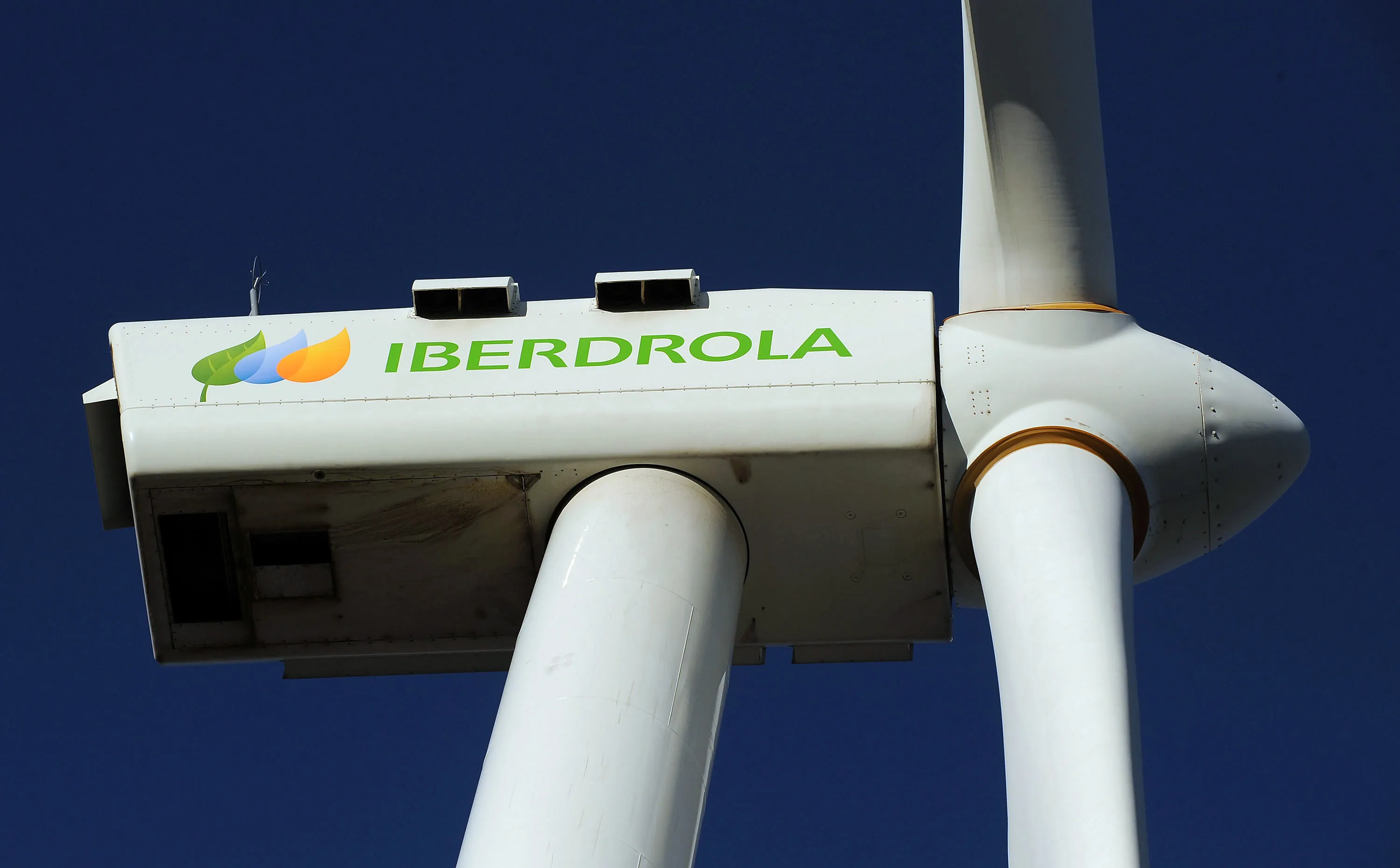 The logo of Iberdrola Renovables SA sits on a wind turbine at the Maranchon wind farm in Maranchon, Spain, on Monday, Oct. 18, 2010.