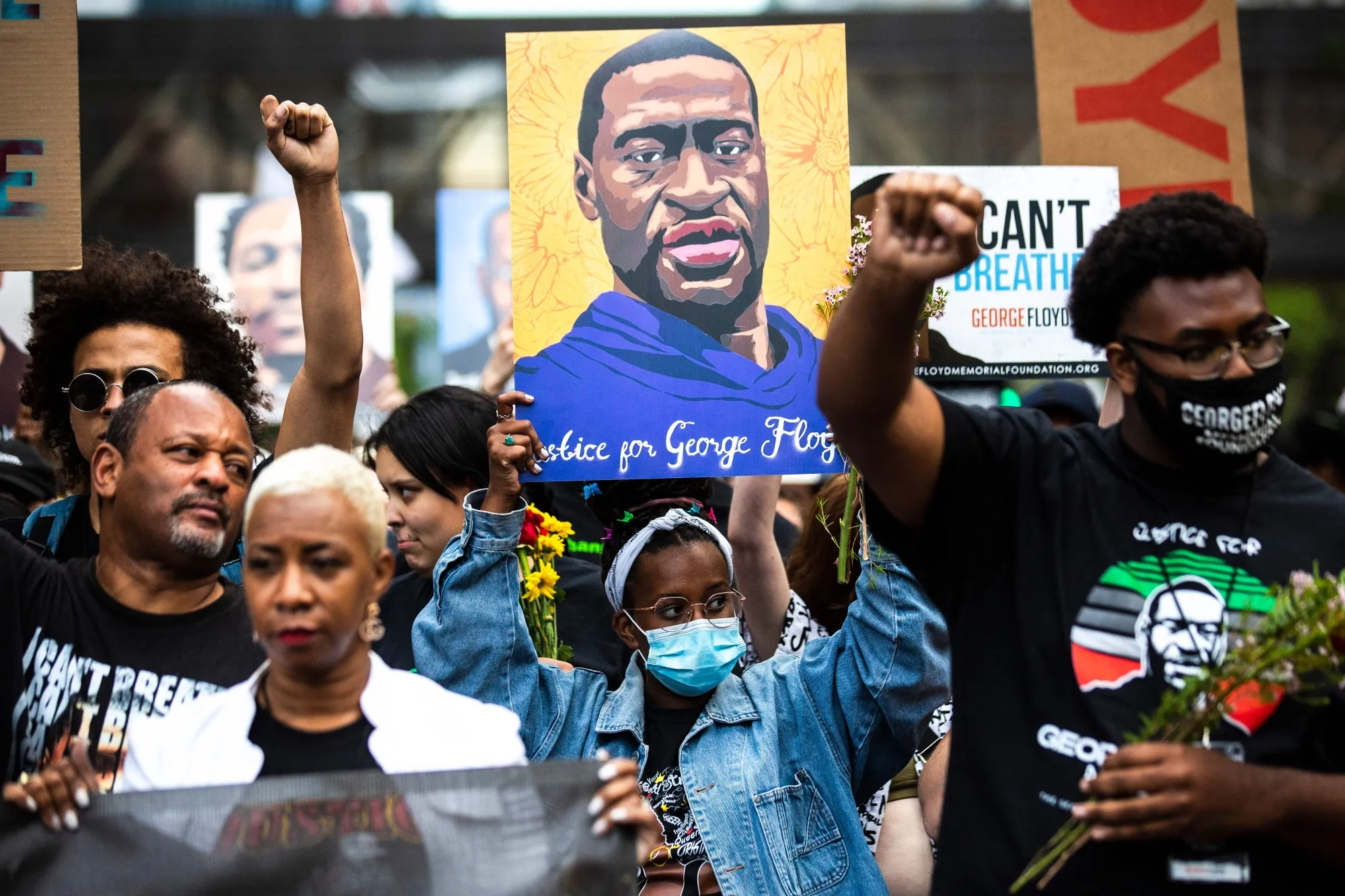 People&nbsp;march in remembrance of George Floyd in Minneapolis.