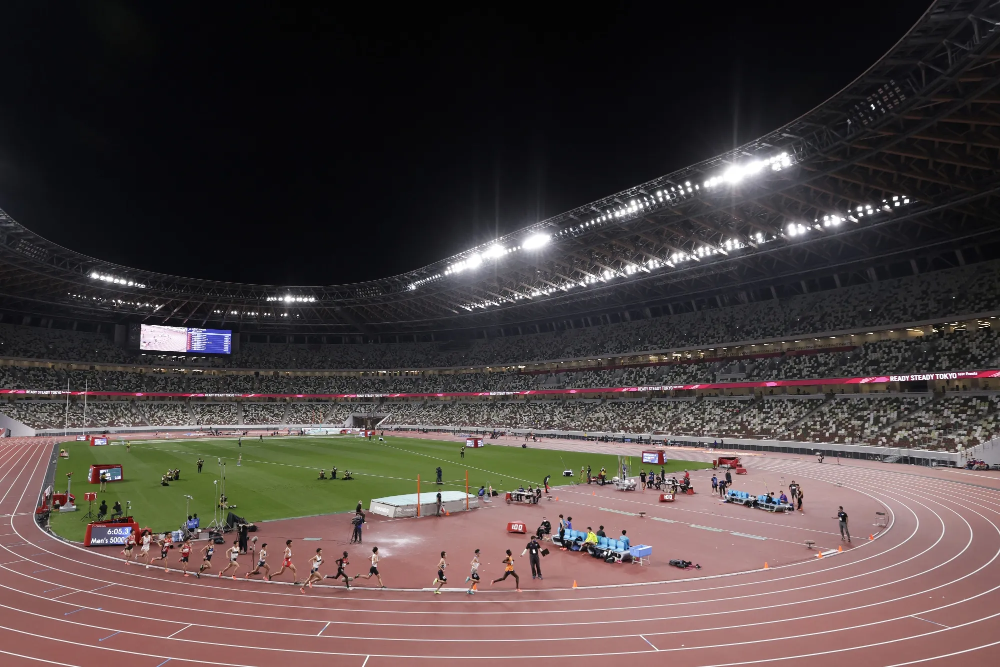 Athletes compete during an athletics test event for the Tokyo 2020 Olympic Games at the National Stadium in Tokyo, on May 9.