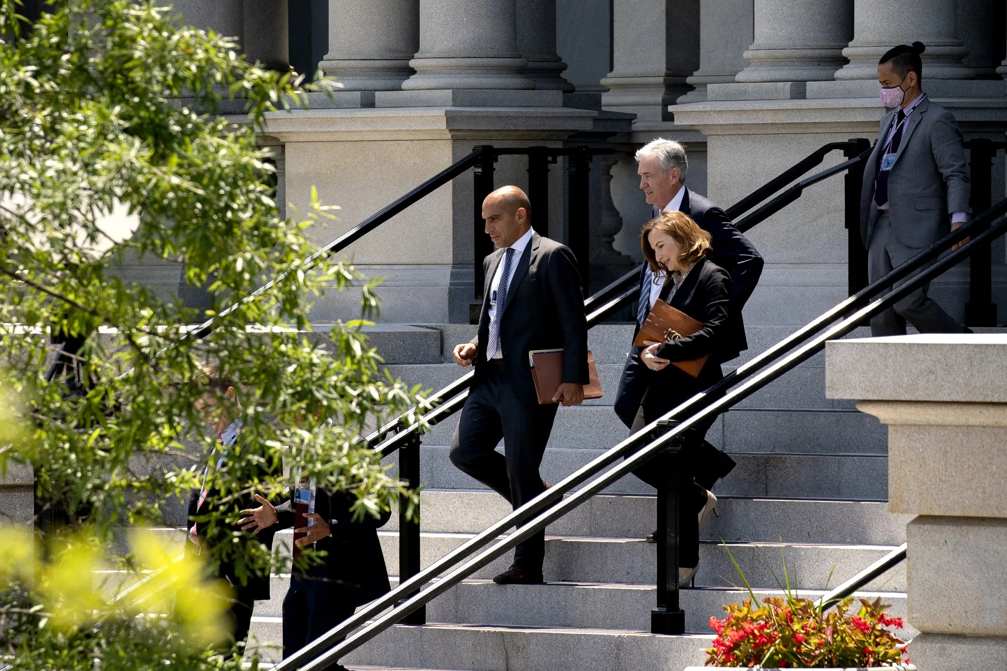 Rostin Behnam, acting chairman of the Commodity Futures Trading Commission, from left, Jerome Powell, chairman of the U.S. Federal Reserve, and Jelena McWilliams, chairman of the Federal Deposit Insurance Corporation, walk to the West Wing of the White House in Washington, D.C., on&nbsp;June 21.&nbsp;