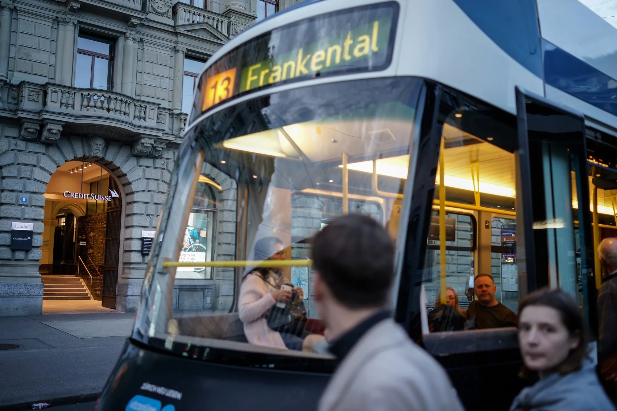 A tram passes the Credit Suisse Group AG headquarters in Zurich.