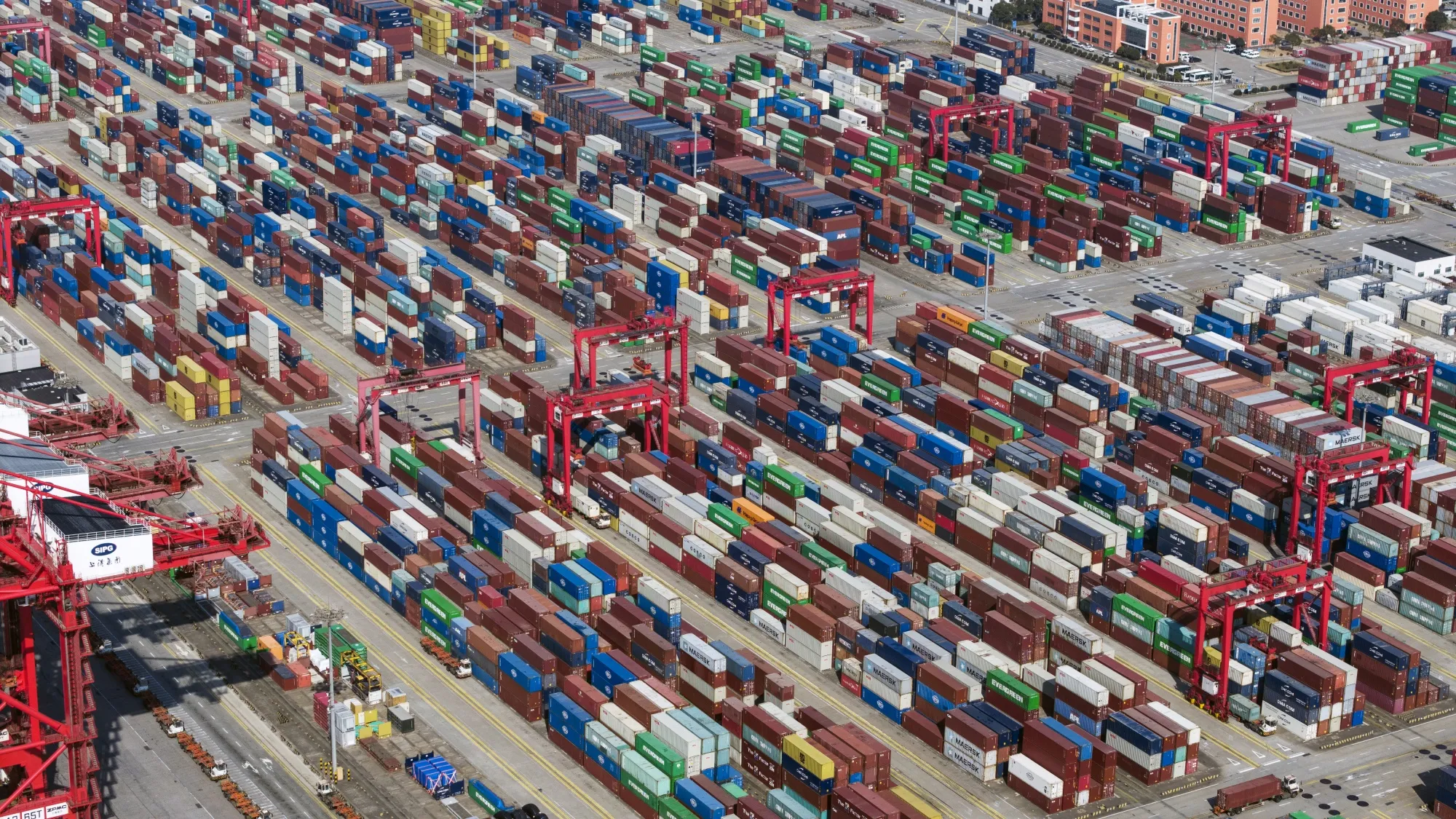 Gantry cranes and shipping containers at the Yangshan Deepwater Port in Shanghai, China