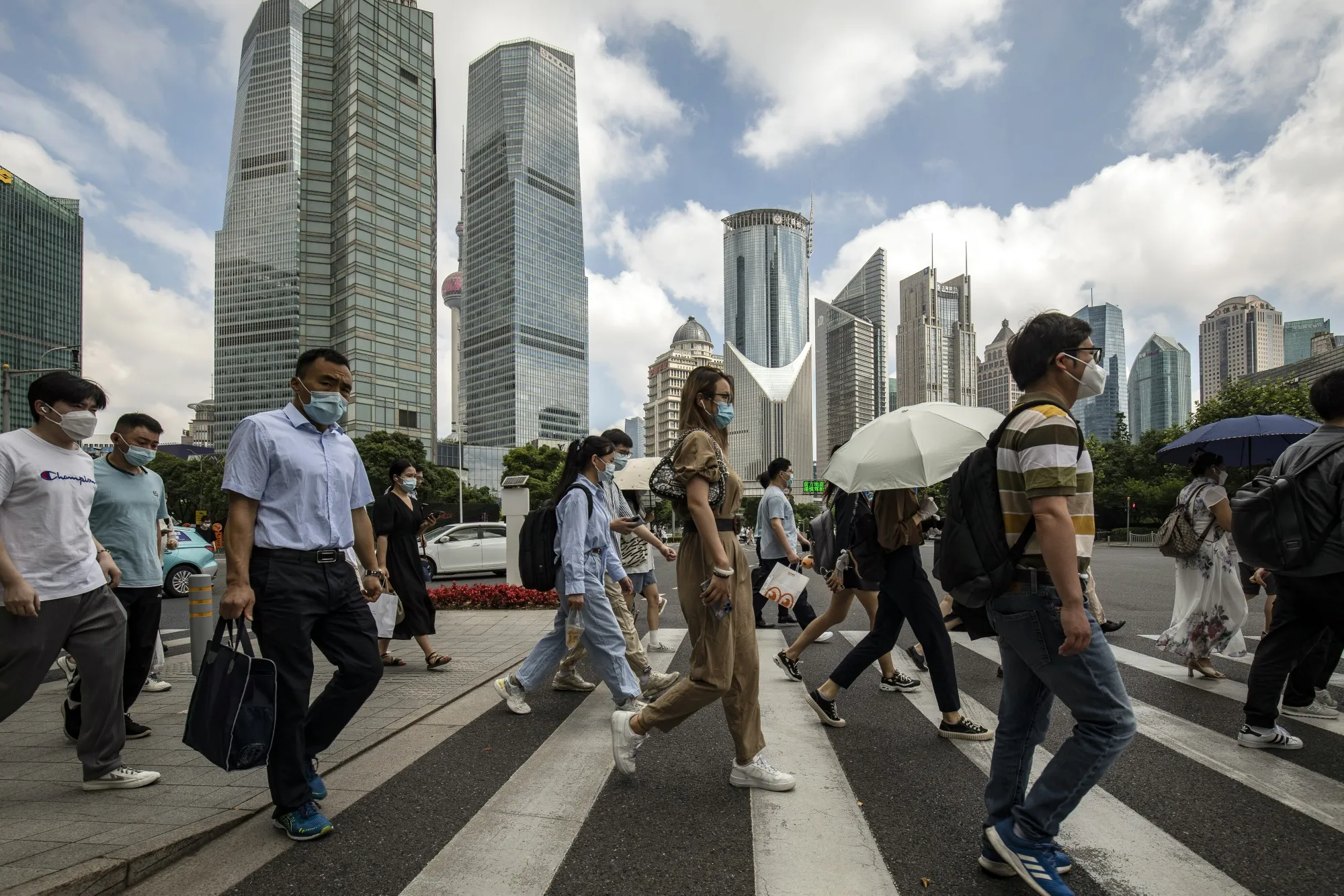 Pedestrians Pudong's Lujiazui Financial District in Shanghai.